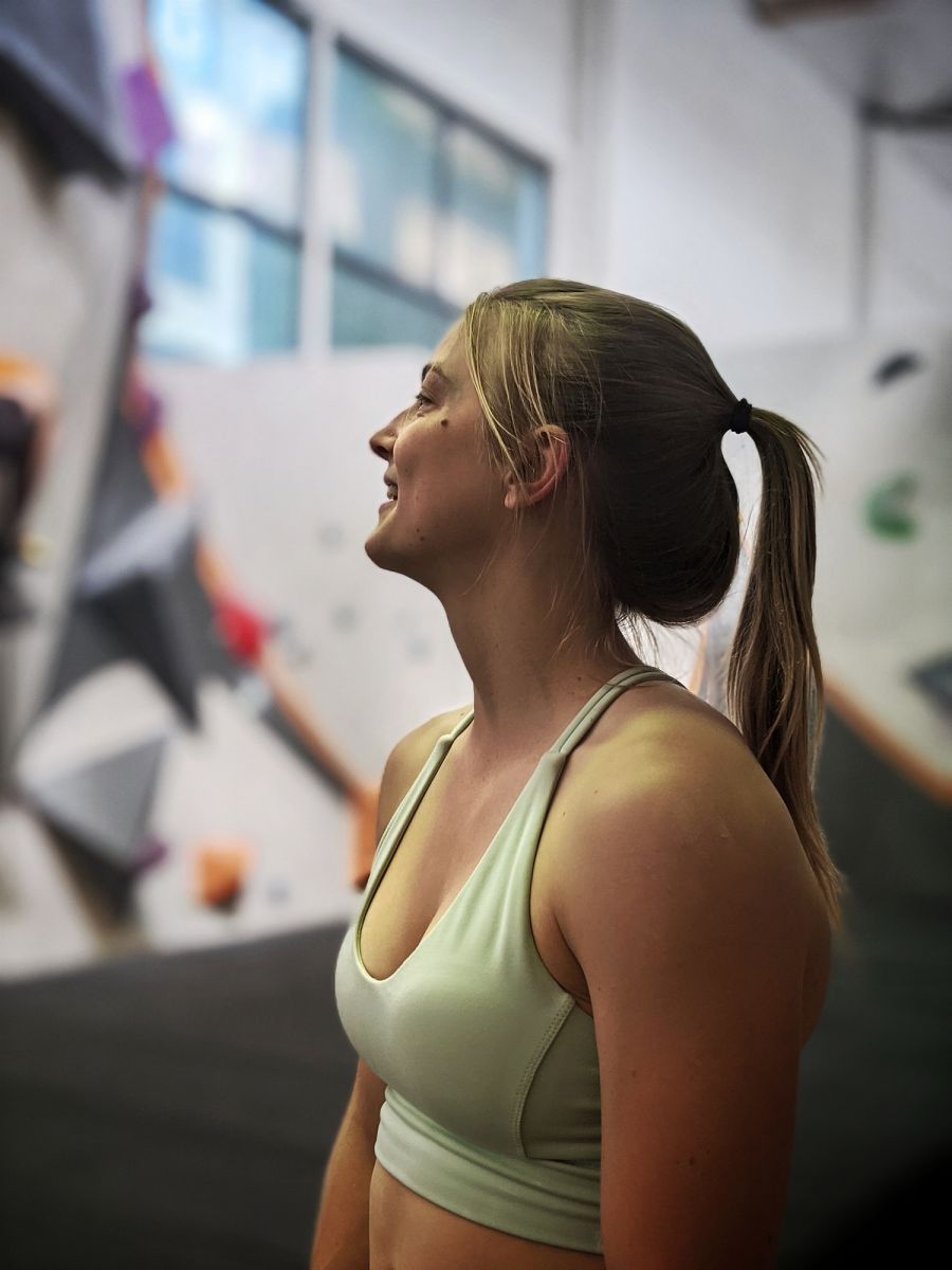 Lucy in her home-away-from-home: the climbing gym! Photo by Alex Turnbull.