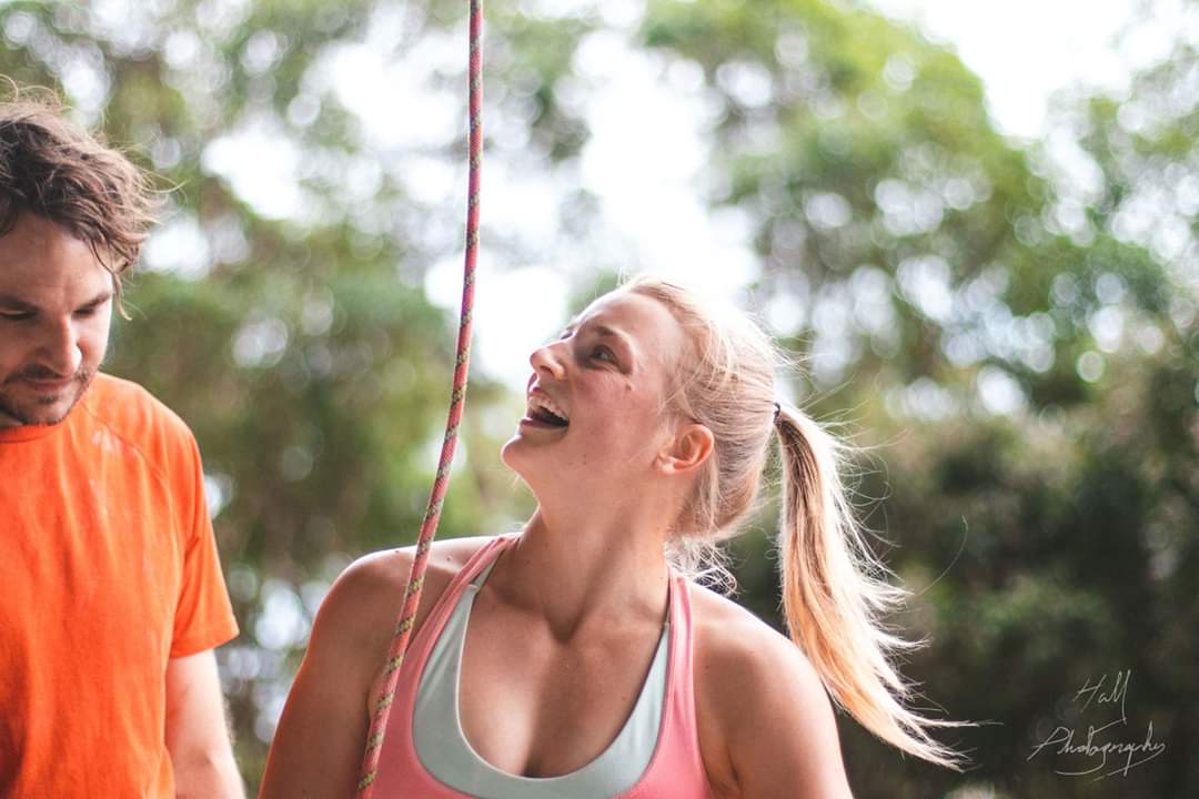 Lucy Stirling psyched on an outdoor climb. Photo by Victor Hall.